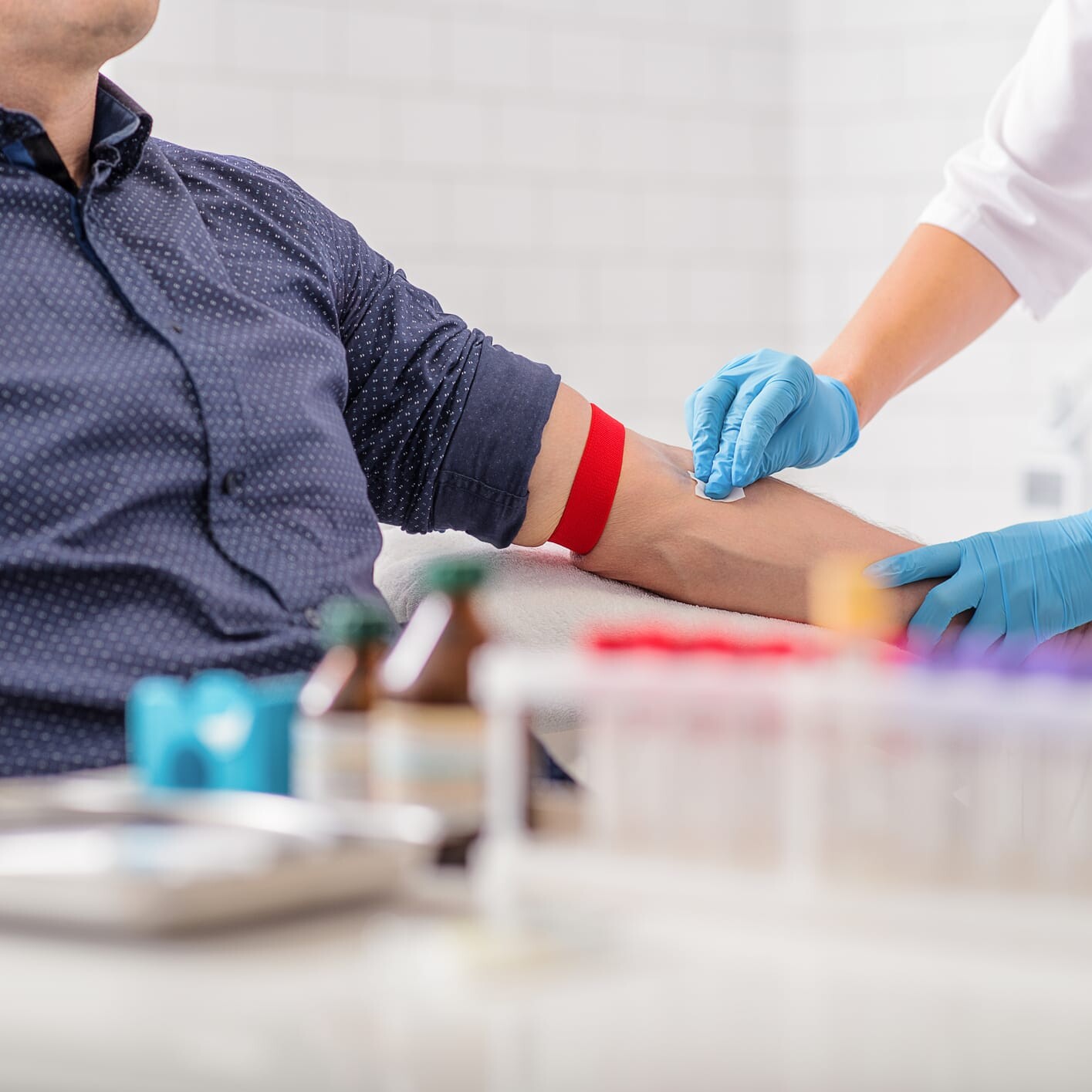 man having blood analysis test by functional health expert