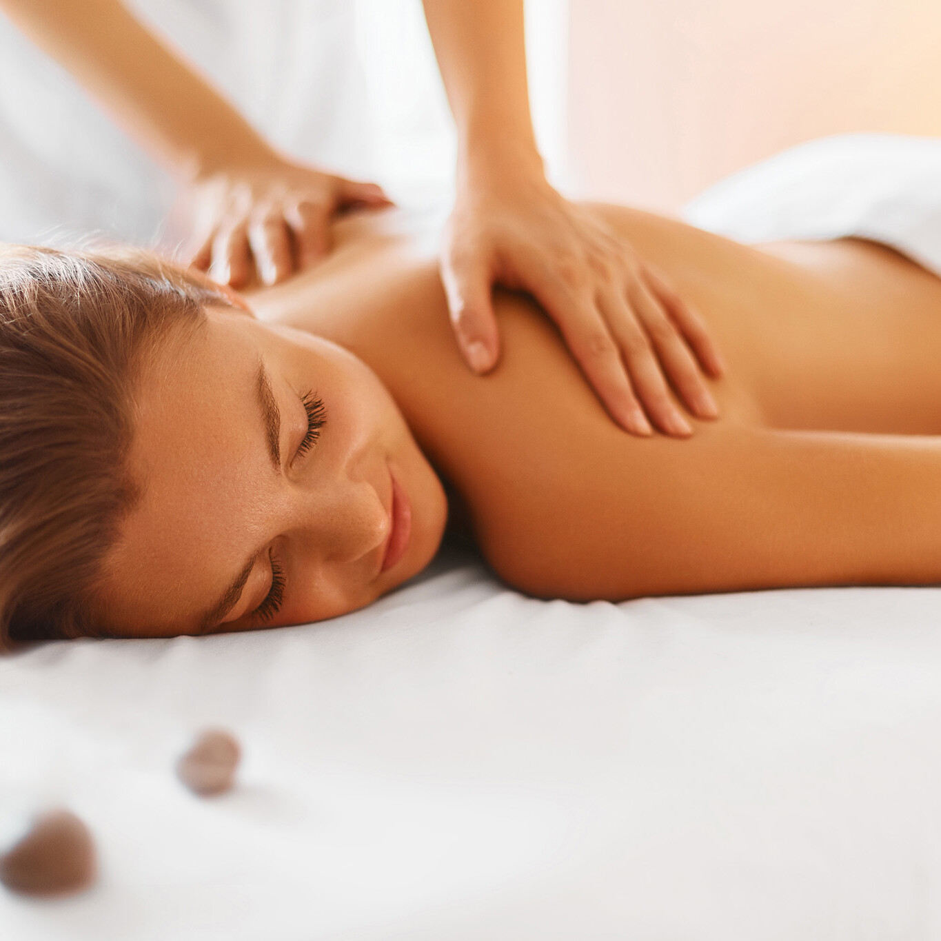 photo of a woman being gien massage therapy